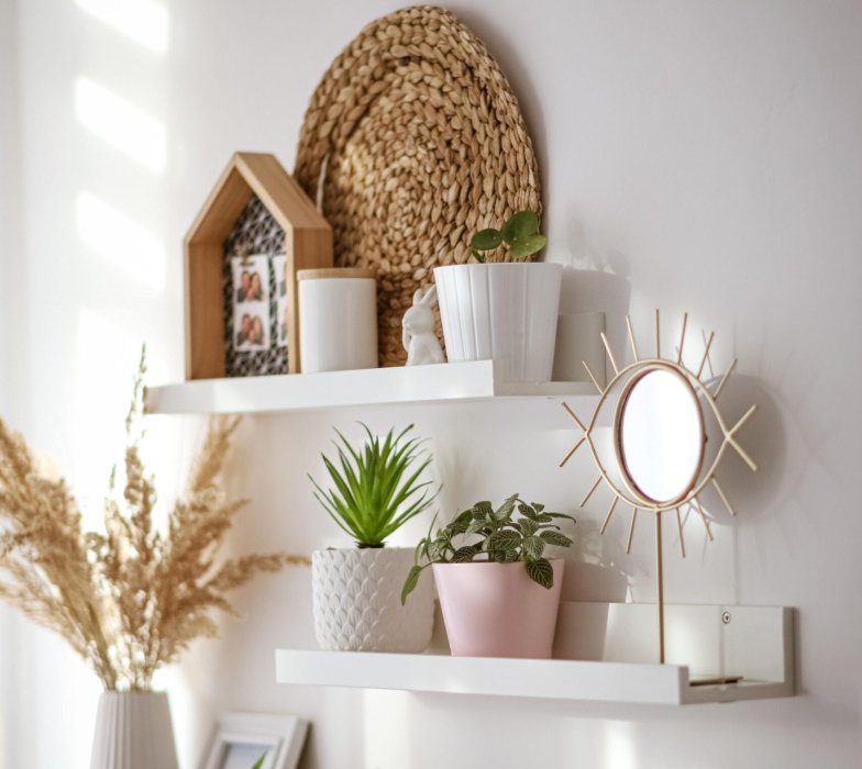 A mirror with a shape of eye on the shelves